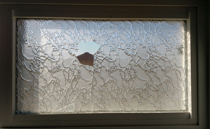 Dual Pane sliding vinyl window with a broken glass pane in Canyon Country, CA.
