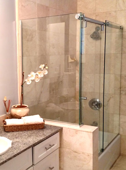 A 3/8" heavy glass frameless shower with channel installed at a bathroom remodel in Newhall, CA